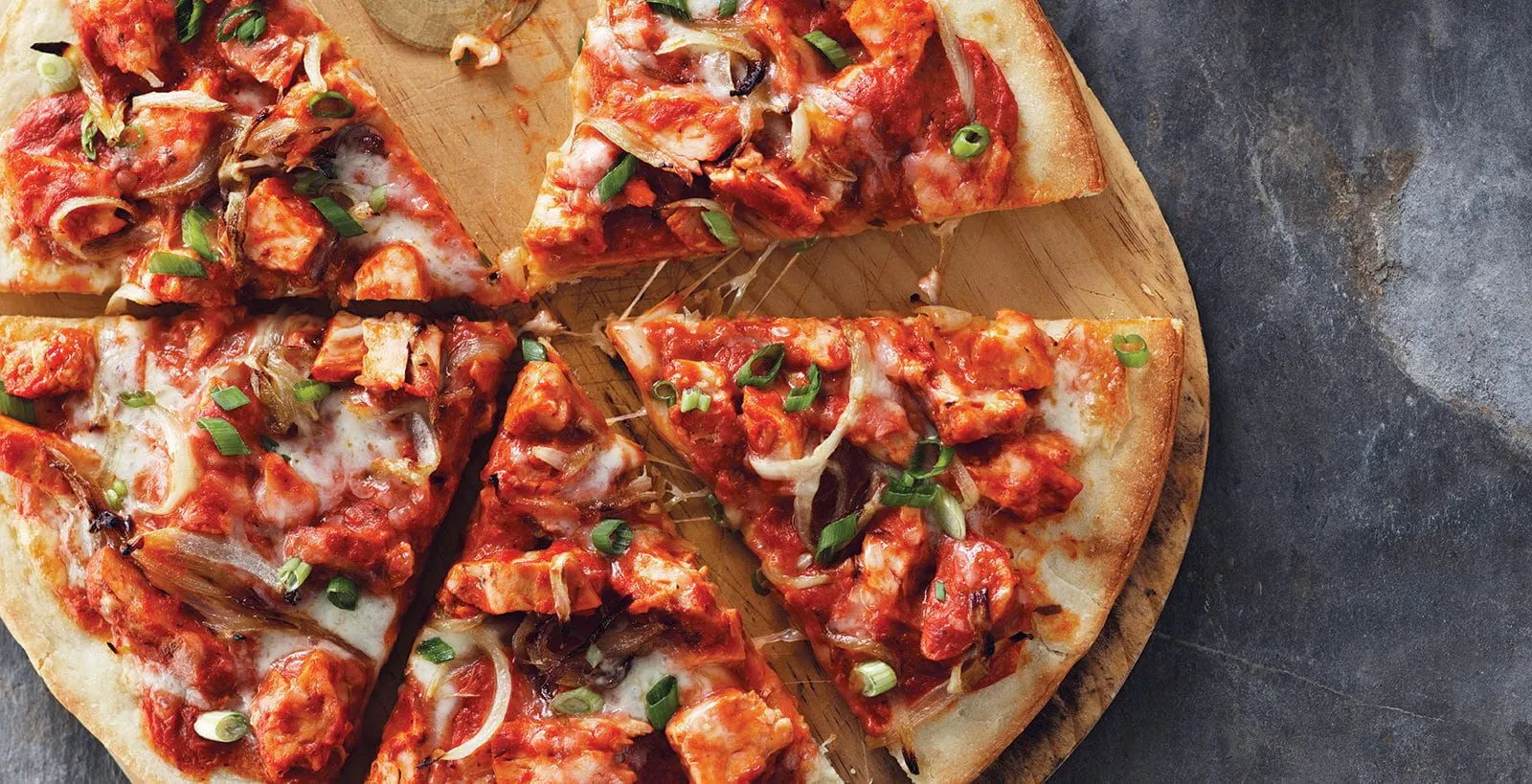 Delicious Butter Chicken pizza at Calgary Pizza Master in Calgary, AB